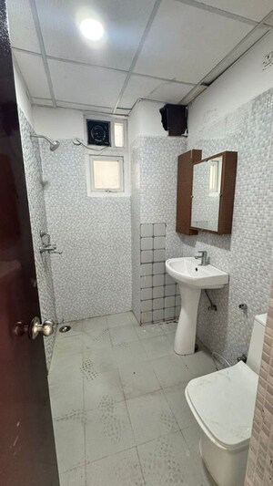 Bathroom in 2 BHK Apartment at Urban Axis Urban Woods, Sushant Golf City – for Rent