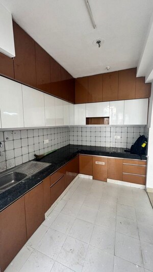 Kitchen in 2 BHK Apartment at Urban Axis Urban Woods, Sushant Golf City – for Rent