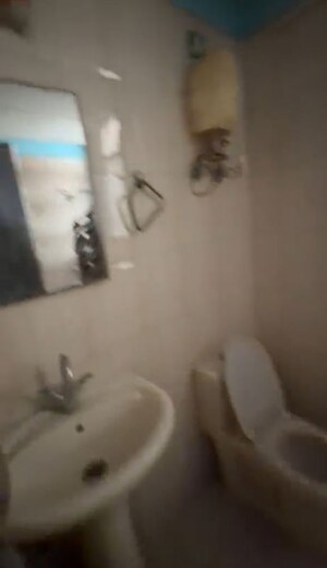 Bathroom in 2 BHK Apartment at Grah Avas Green View Heights, Raj Nagar Extension – for Rent
