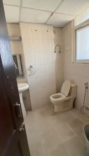 Bathroom in 2 BHK Apartment at Grah Avas Green View Heights, Raj Nagar Extension – for Rent