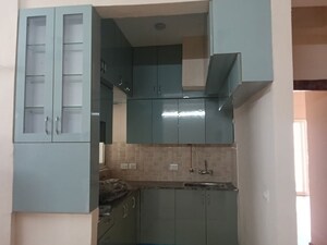 Kitchen in 2 BHK Apartment at Amrapali Dream Valley – for Rent