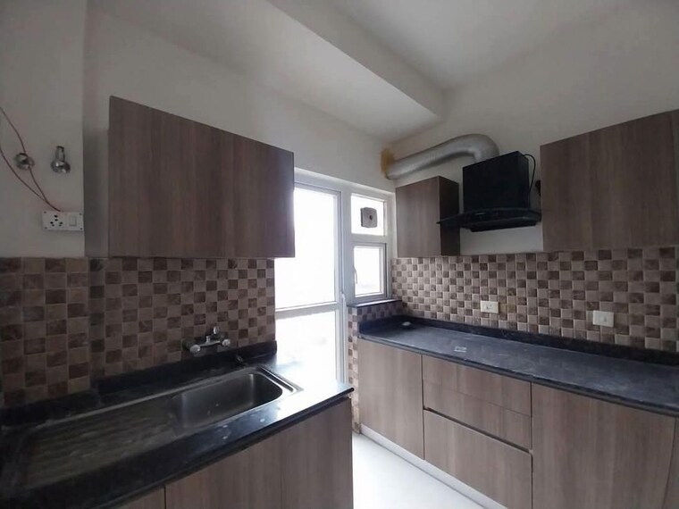 Kitchen, adani-oyster-grande-phase-2 3 Bedroom 1889 Sq.Ft. Apartment In Sector 102 Gurgaon 10460174