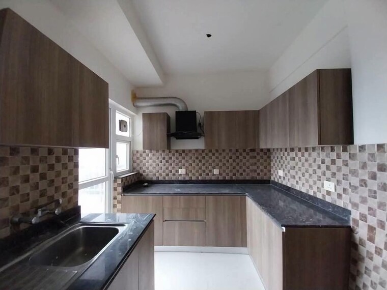 Kitchen, adani-oyster-grande-phase-2 3 Bedroom 1889 Sq.Ft. Apartment In Sector 102 Gurgaon 10460174