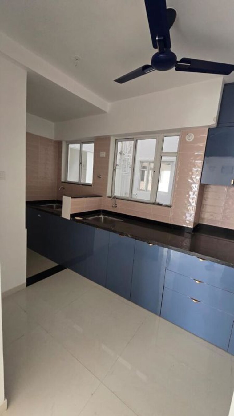 Kitchen, ng-rathi-palm-nest 2 Bedroom 800 Sq.Ft. Apartment In Wagholi Pune 10460429
