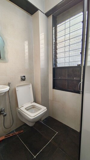 Bathroom in 1 BHK Apartment at Atharwa CHS, Mulund East – for Rent