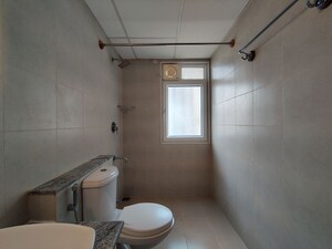 Bathroom in  Apartment at Bhartiya Nikoo Homes Phase 2, Thanisandra Main Road – for Rent