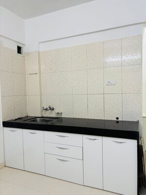 Kitchen in 1 BHK Apartment at Gangadham Apartment, Market Yard – for Rent