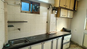Kitchen in 2 BHK Apartment at Savitri Smriti CHS, Santacruz East – for Rent