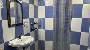 Bathroom in 2 BHK Apartment at Arun Vihar Sector 37, Sector 37 – for Rent