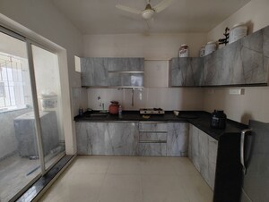 Kitchen in 2.5 BHK Apartment at Abhinav Pebbles Urbania, Bavdhan – for Sale