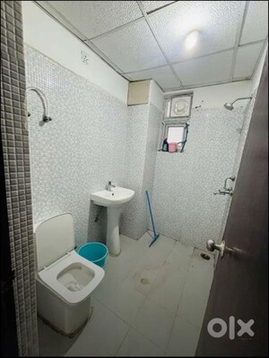 Bathroom in 2 BHK Apartment at Urban Axis Urban Woods, Sushant Golf City – for Rent