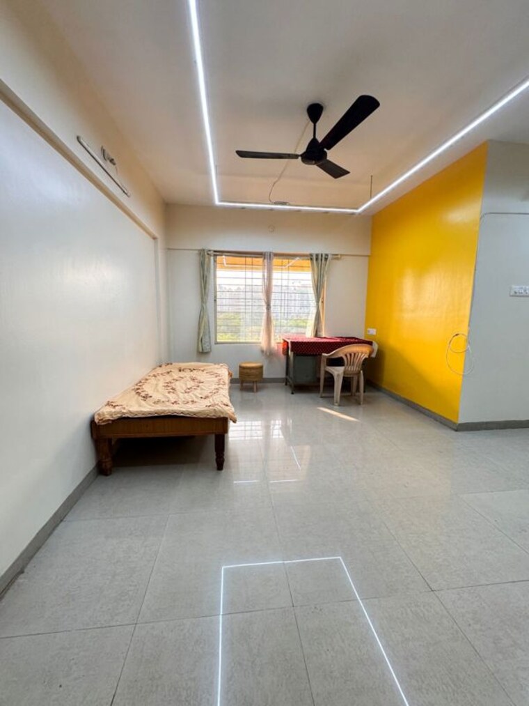 Living Room, unicons-nirmitee-echinus-court 2 Bedroom 850 Sq.Ft. Apartment In Balewadi Pune 10462723