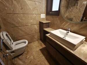 Bathroom in 4 BHK Builder Floor at Green Park Extension – for Rent