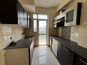 Kitchen in 2 BHK Apartment at Prateek Wisteria, Sector 77 – for Sale