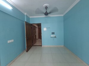 Living Room in 1 BHK Apartment at Chaitanya Radha Raman CHS, Dahisar West – for Rent