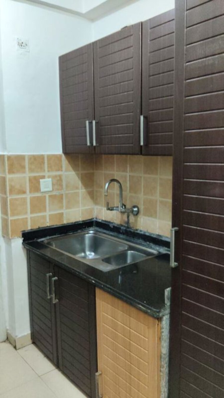 Kitchen, rwa-apartments-sector-21 2.5 Bedroom 840 Sq.Ft. Builder Floor In Sector 21 Noida 10463877