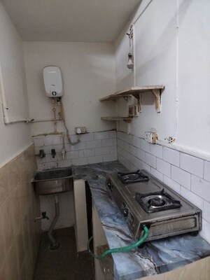 Kitchen in 1 RK Apartment at Arun Vihar, Sector 29 – for Rent
