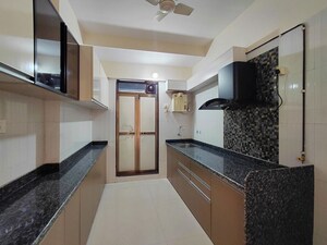 Kitchen in 2 BHK Apartment at Asmita Sand Dunes, Malad West – for Rent