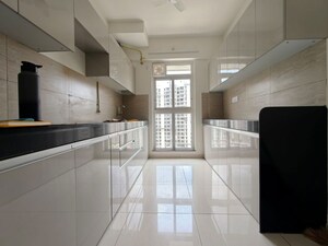 Kitchen in 3 BHK Apartment at Godrej Emerald, Ghodbunder Road – for Rent