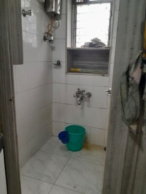Bathroom in 2 BHK Apartment at Nivara Deepanjali CHSL, Vile Parle East – for Rent