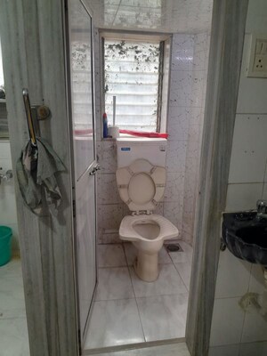 Bathroom in 2 BHK Apartment at Nivara Deepanjali CHSL, Vile Parle East – for Rent