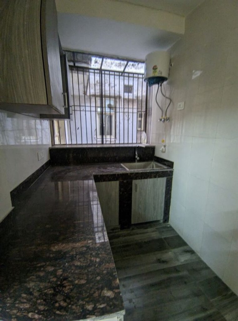 Kitchen, eros-southend-apartments 2 Bedroom 827 Sq.Ft. Apartment In Charmwood Village Faridabad 10466320