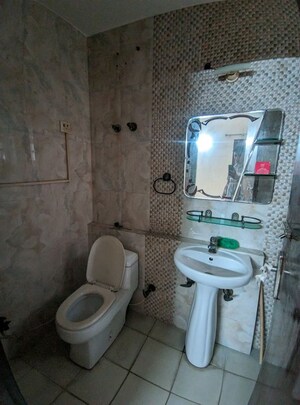 Bathroom in 2 BHK Apartment at Eros Southend Apartments, Charmwood Village – for Rent
