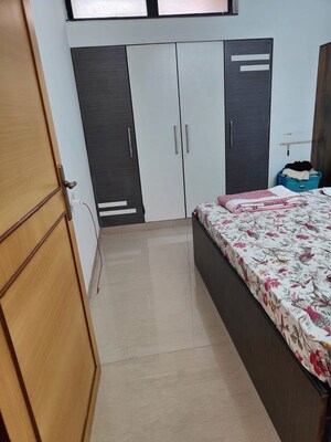 Bedroom in 2 BHK Apartment at K Raheja Heights, Malad East – for Rent