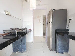 Kitchen in 1.5 BHK Apartment at Godrej Emerald, Ghodbunder Road – for Rent