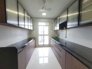 Kitchen in 3 BHK Apartment at Godrej Emerald, Ghodbunder Road – for Rent