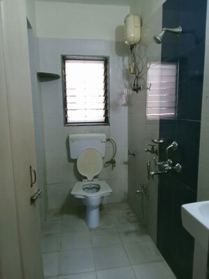 Bathroom in 2 BHK Apartment at Sai Baba Vihar Complex, Ghodbunder Road – for Rent