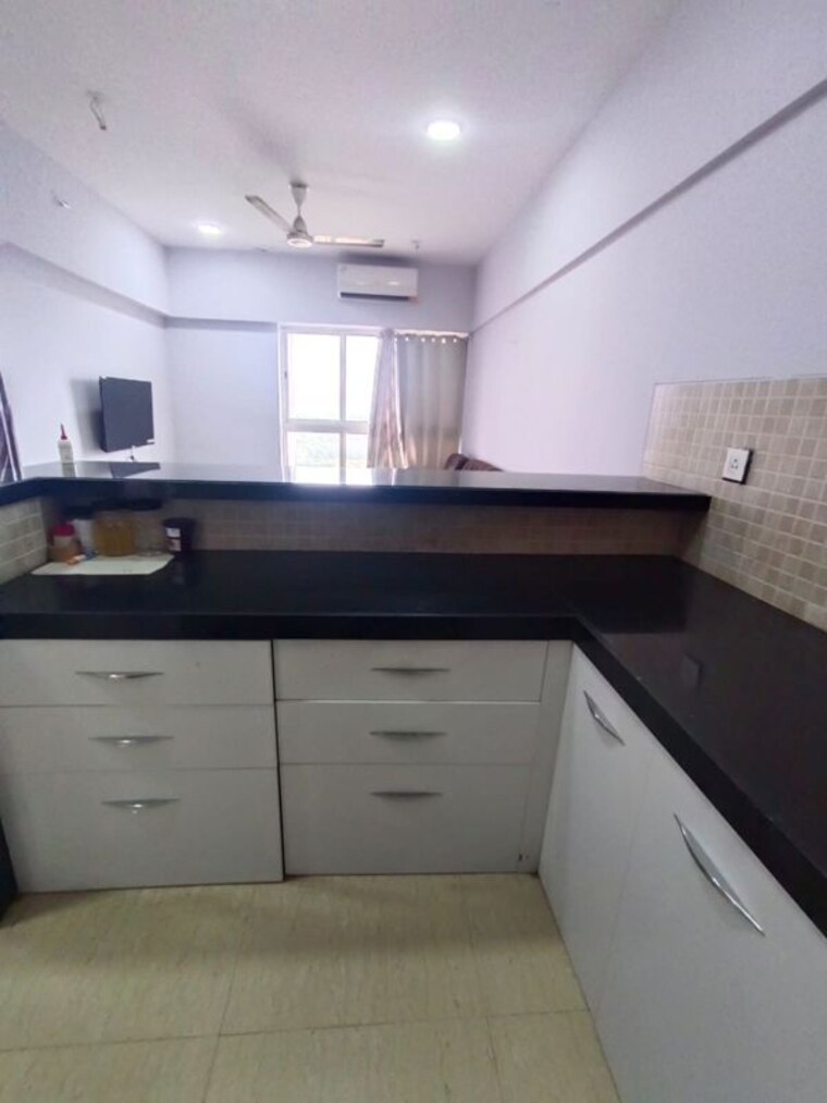 Kitchen, lodha-belmondo-st-andrews-b-c-d-villa-1-to-28 1 Bedroom 780 Sq.Ft. Apartment In Gahunje Pune 10467337