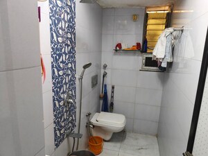 Bathroom in 2 BHK Apartment at Om Shri Yashodhan CHS, Goregaon East – for Rent