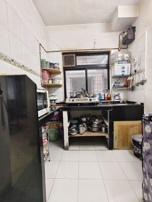 Kitchen in 1 BHK Apartment at Akhurath CHS, Sanpada – for Rent