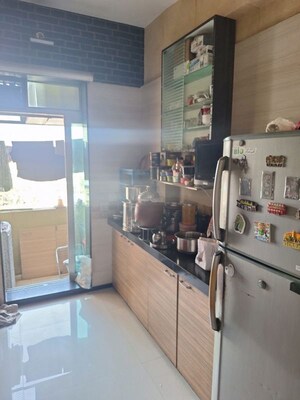 Kitchen in 2 BHK Apartment at Pakshal CHS , Mira Road – for Sale
