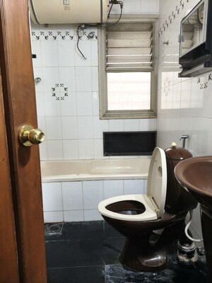 Bathroom in 3.5 BHK Apartment at Ahura Nishant, Model Colony – for Rent