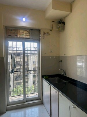 Kitchen in 1 BHK Apartment at Vijay Galaxy, Waghbil – for Rent