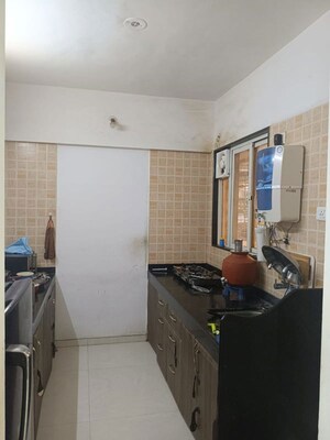 Kitchen in 2 BHK Apartment at GK Rose Mansion, Punawale – for Rent