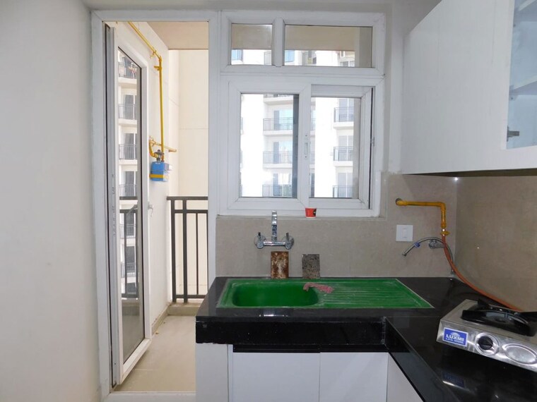 Kitchen, eldeco-live-by-the-greens 3 Bedroom 1404 Sq.Ft. Apartment In Sector 150 Noida 10468594