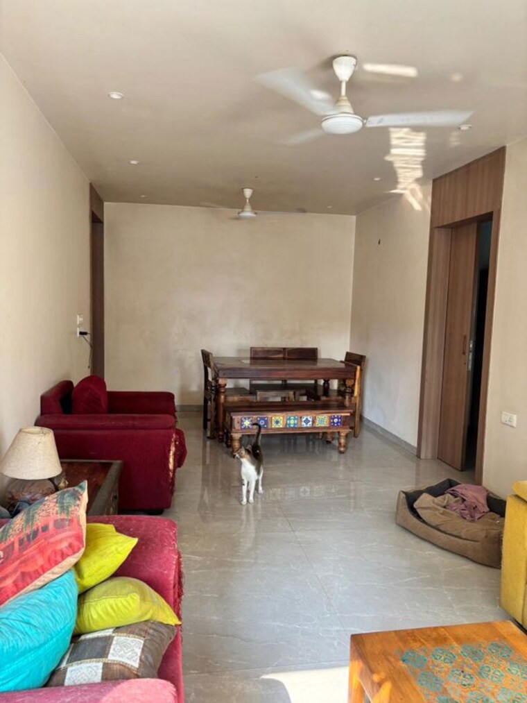 Living Room, oyster-shell 2 Bedroom 820 Sq.Ft. Apartment In Juhu Mumbai 10468914