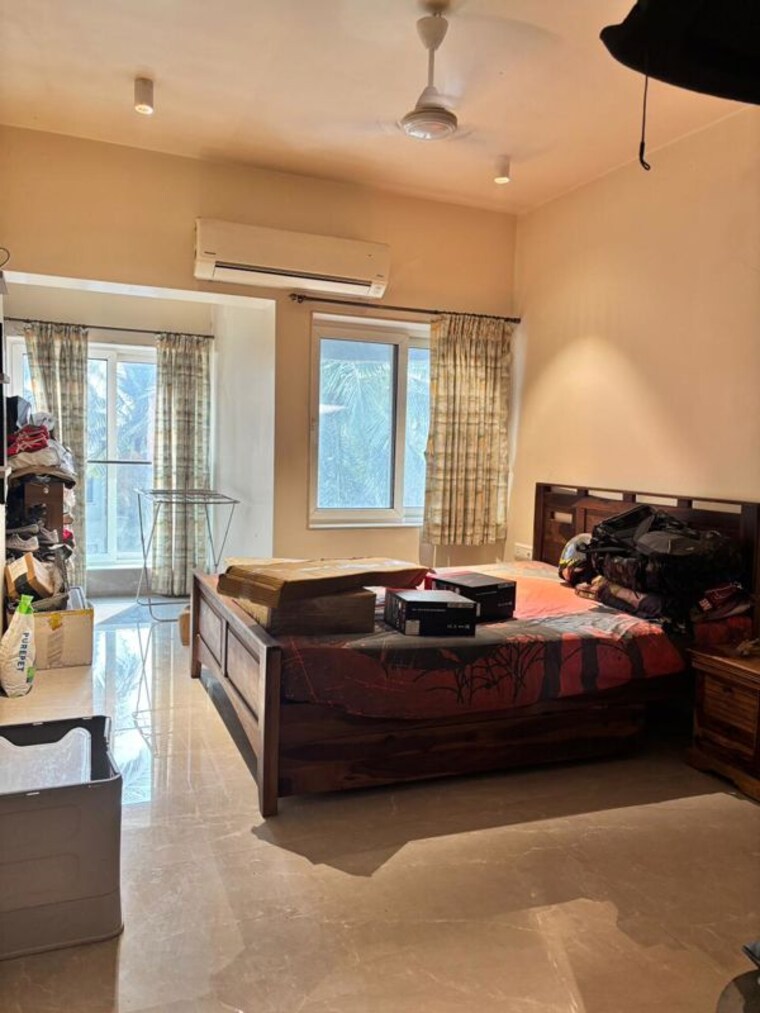 Living Room, oyster-shell 2 Bedroom 820 Sq.Ft. Apartment In Juhu Mumbai 10468914