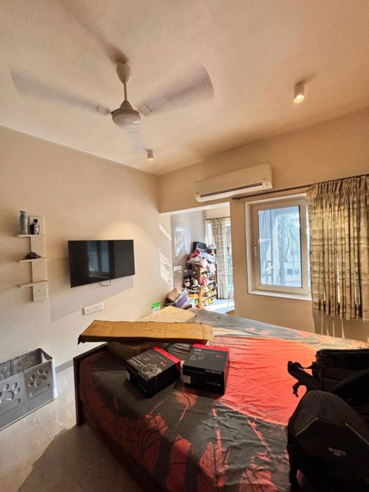 Living Room, oyster-shell 2 Bedroom 820 Sq.Ft. Apartment In Juhu Mumbai 10468914