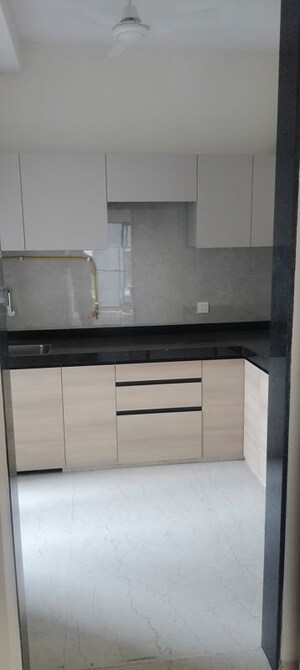 Kitchen in 2 BHK Apartment at Our Home CHS, Andheri West – for Sale