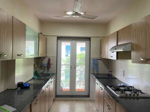 Kitchen in 4 BHK Apartment at Gym View, Khar West – for Rent