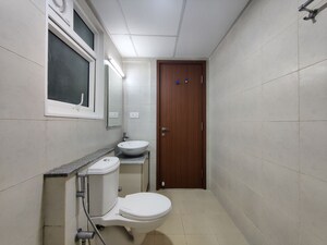 Bathroom in  Apartment at Bhartiya Nikoo Homes Phase 2, Thanisandra Main Road – for Rent