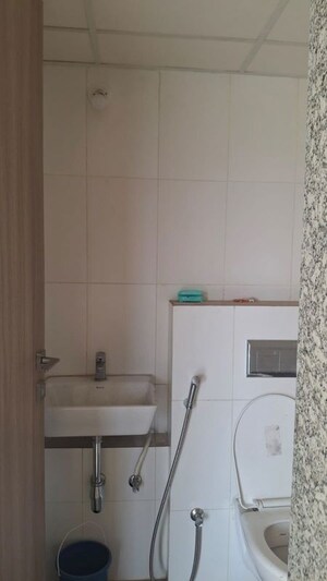 Bathroom in 1 BHK Apartment at Godrej Nirvaan, Themghar – for Rent