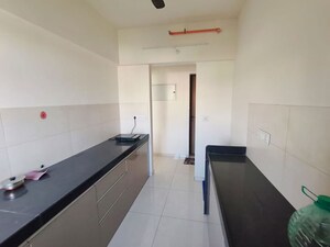 Kitchen in 2 BHK Apartment at Godrej Nirvaan, Themghar – for Rent