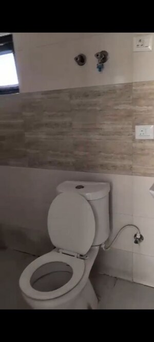 Bathroom in 2 BHK Apartment at Charms Castle, Raj Nagar Extension – for Sale