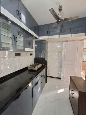 Kitchen in 4 BHK Apartment at Lokhandwala Infrastructure Whispering Palms XXclus, Kandivali East – for Rent