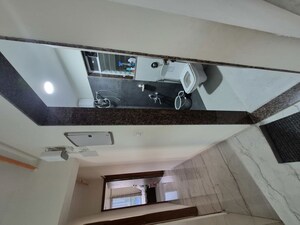 Kitchen in 2.5 BHK Apartment at Dahanukar Wadi – for Sale